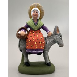 Femme sur l'âne